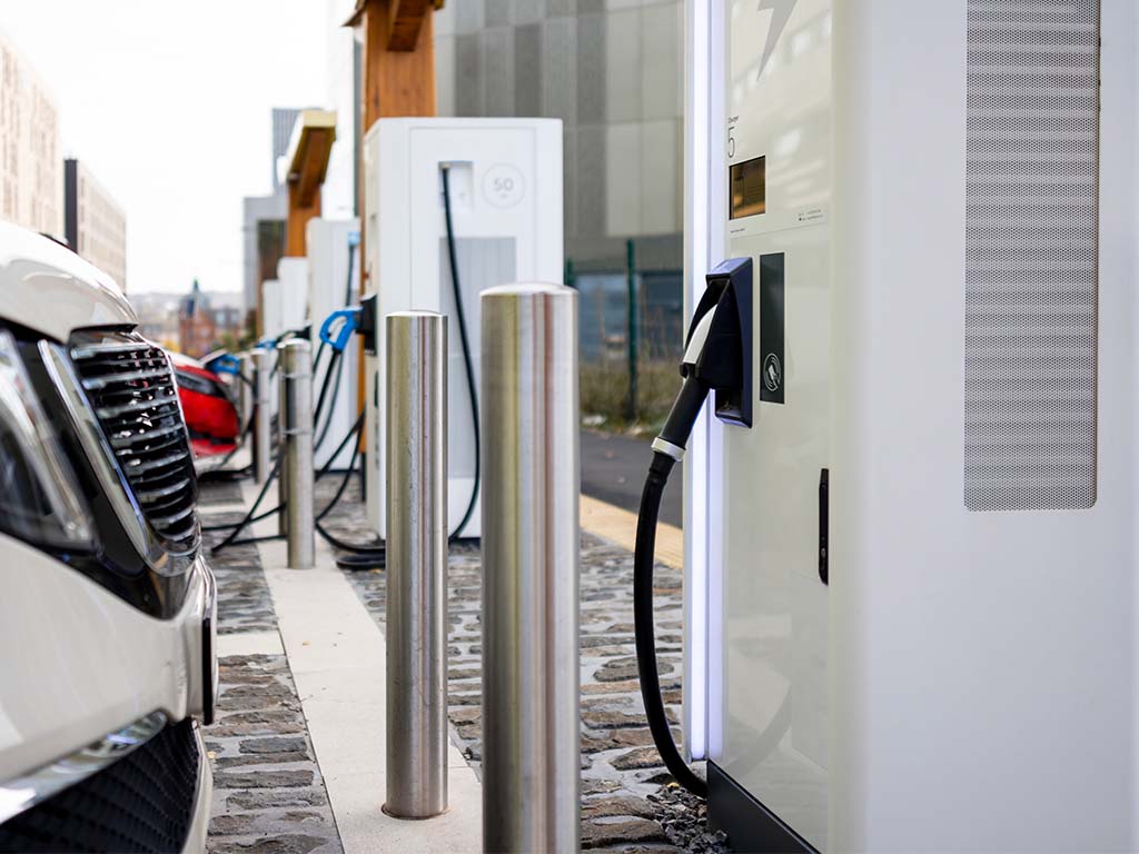 Bollards protecting EV charging station.